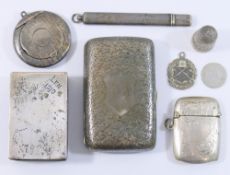 A collection of small silver items comprised of a matchbox holder, thimble, cigarette case,