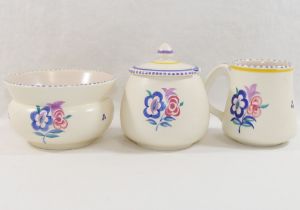 A collection of twelve items of mainly 1950's and later Poole Pottery, hand painted with flowers,
