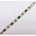 A Chinese yellow metal and jadeite bracelet stamped '14K', 10.