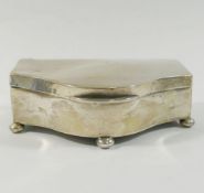 An early 20th century silver trinket box, with hinged lid, ball feet, and satin lining,