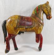 An Indo-Persian painted wooden horse, depicted in ceremonial trappings,