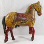 An Indo-Persian painted wooden horse, depicted in ceremonial trappings,