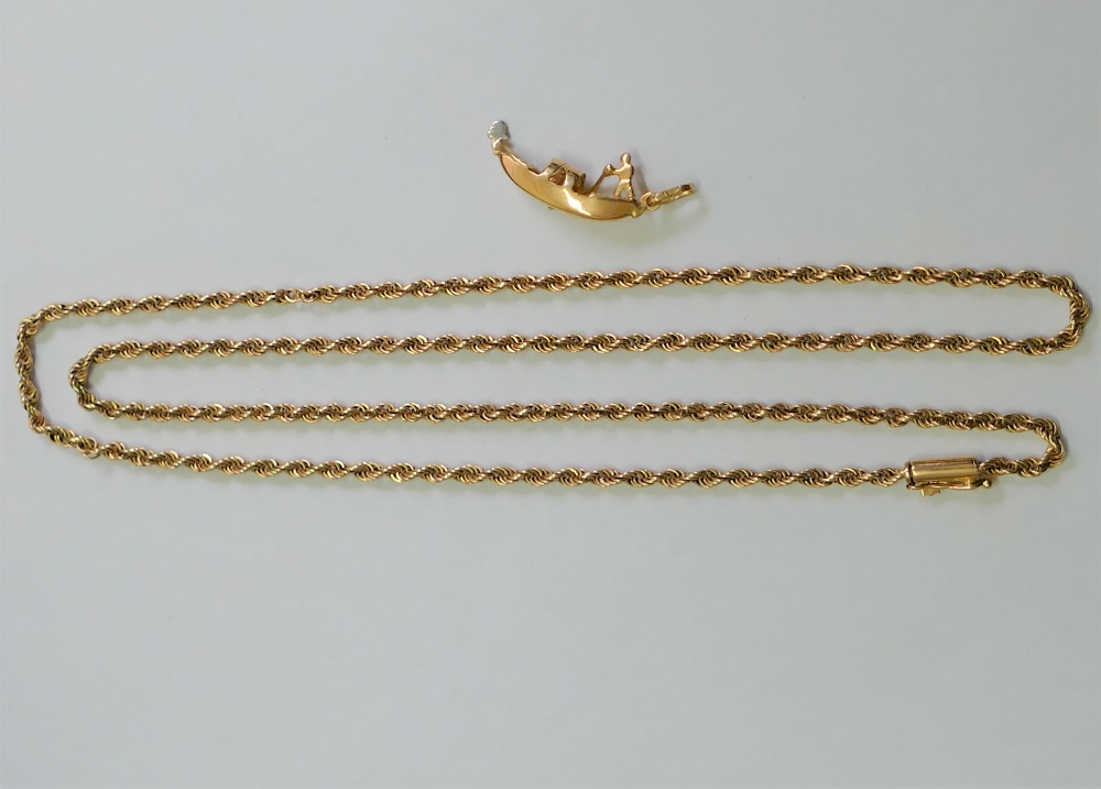 A yellow metal rope twist chain, with barrel clasp, stamped '18K', 64.5cm long, 16.