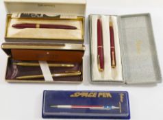 A red and gold plated Parker ballpoint pen and matching Parker No.