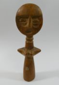 An Ashanti carved wooden female fertility figure, 16.