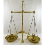A set of brass apothecary scales, 56.
