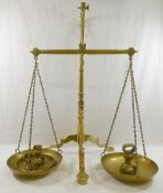 A set of brass apothecary scales, 56.