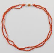 A Victorian double row coral necklace, the small oval beads each approximately 2.
