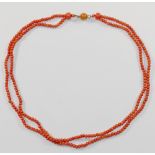 A Victorian double row coral necklace, the small oval beads each approximately 2.