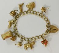 A 9 carat gold curb link charm bracelet, London 1973, with ten charms including a cow,