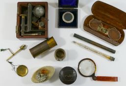A 19th century brass miniature microscope, housed in fitted mahogany case (lid lacking),