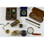 A 19th century brass miniature microscope, housed in fitted mahogany case (lid lacking),