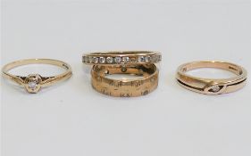 Two 9 carat gold diamond set rings,