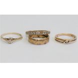 Two 9 carat gold diamond set rings,