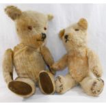 An early 20th century blonde mohair plush jointed teddy bear with glass eyes,
