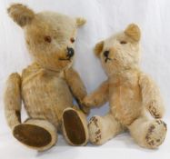 An early 20th century blonde mohair plush jointed teddy bear with glass eyes,