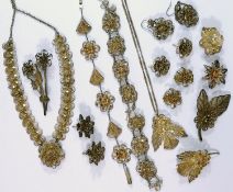 A filigree flowerhead brooch stamped '800', and other assorted filigree items including a necklace,