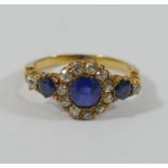 A late Victorian/Edwardian sapphire and diamond cluster ring,