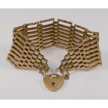 A large 9 carat gold gate link bracelet, with heart-shaped padlock clasp, London 1976, 2.