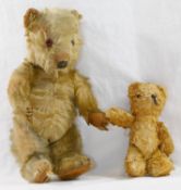 An early 20th century blonde mohair plush jointed teddy bear with glass eyes,