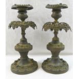 An ornate brass three light candleabra, cast with a cherub and converted to electricity, 38cm high,