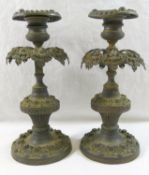 An ornate brass three light candleabra, cast with a cherub and converted to electricity, 38cm high,