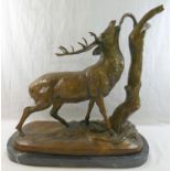 After Pierre Jules Mene, 20th century patinated bronze of a braying stag besides a tree stump,