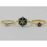 A yellow metal garnet and diamond ring, the shank stamped '750', finger size O 1/2,