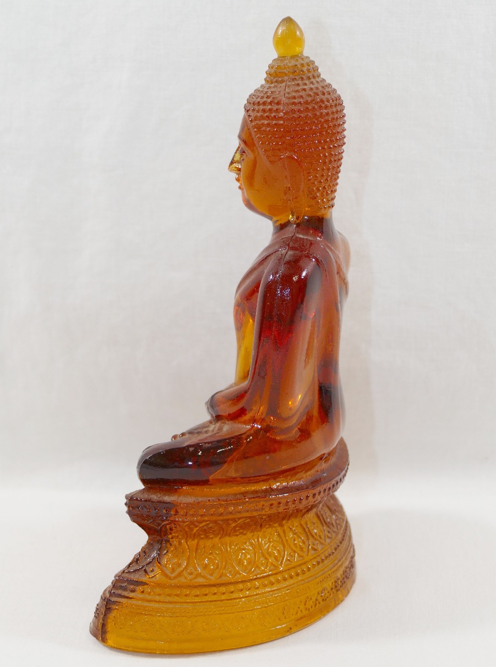 An amber glass seated Buddha, the hollow - Image 2 of 3