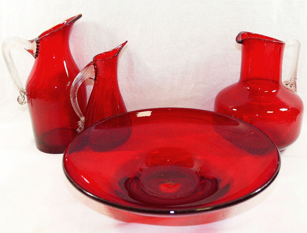 Three Whitefriars ruby glass jugs, the t