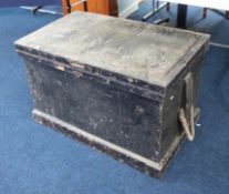A heavy black tool chest fitted with sections of drawers comprising some wood working tools