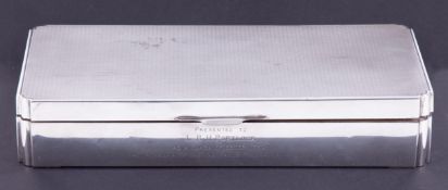 A large silver cigarette/cigar box, 26cm x 13cm, with presentation inscription dated 1954, 33.41oz.