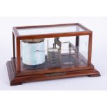 A Negretti & Zambra mahogany cased barograph, number 43414, with personalised plaque dated 1973,