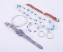 A mixed bag containing a silver bangle, 36.84gm, a glass bead necklace and matching