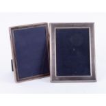 Two silver photo frames, the largest 22cm x 17cm.