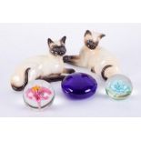 Beswick, two Siamese cats, two paperweights, also a Bristol Blue paperweight (5).