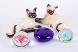 Beswick, two Siamese cats, two paperweights, also a Bristol Blue paperweight (5).