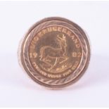 A 9ct yellow gold ornate ring set with a 1/10 Krugerrand 1982, 7.60gm, approx. size M.