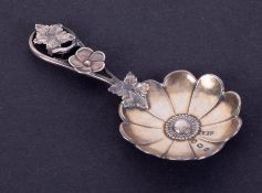 A Victorian silver caddy spoon, by Hilliard and Thomason, Birmingham 1872, lobed circular bowl, wire