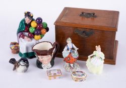 An oak tobacco box together with Halcyon Days enamel box, Doulton figure 'The Old Balloon Seller',