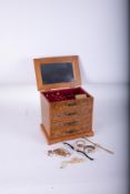 A modern walnut effect jewellery box containing some various jewellery and watches including a 9ct