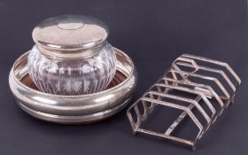 A 20th Century silver six division toast rack, a modern silver wine bottle coaster and a silver &