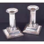 A pair of silver short desk candlesticks with stepped bases, each base marked Jennifer, height 13cm,