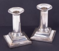 A pair of silver short desk candlesticks with stepped bases, each base marked Jennifer, height 13cm,