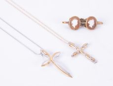 Three items of jewellery to include a Brooks & Bentley 9ct yellow & white gold cross on