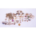 A mixed lot of 9ct, 10ct, 15ct & 18ct gold jewellery to include rings, bracelets, chains,