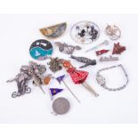 A mixed lot of brooches, including silver boat brooch (Plymouth), charm bracelet, silver omnibus