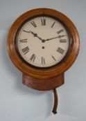 A Victorian mahogany cased dial clock, with key and pendulum.