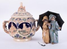 Lladro, a stoneware group of children and brolly together with a German stoneware jar and cover,