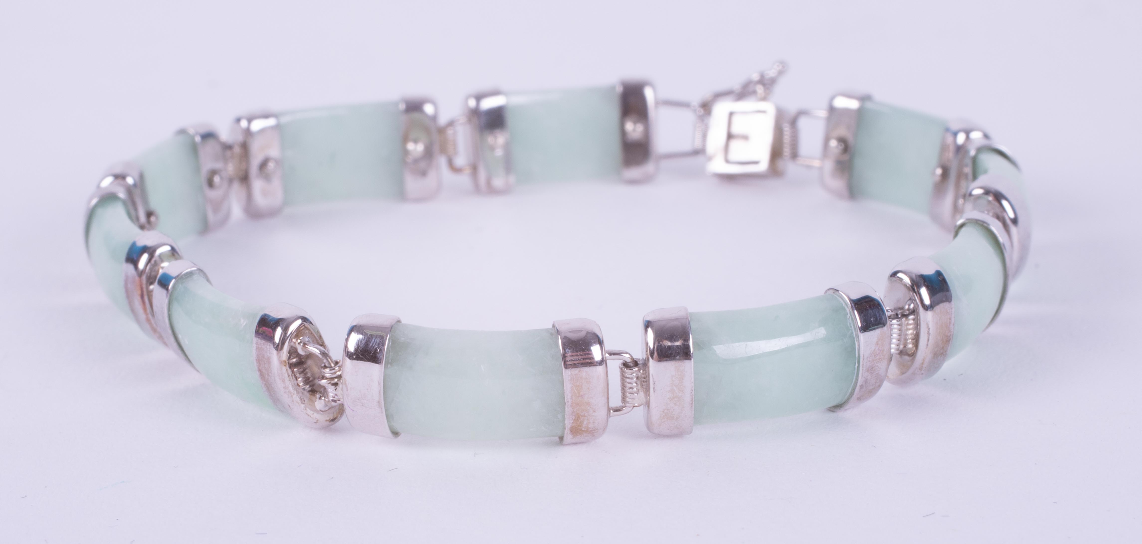 A silver bracelet set with 20 carats of genuine Jade, from Gemporia and comes with a - Image 2 of 2